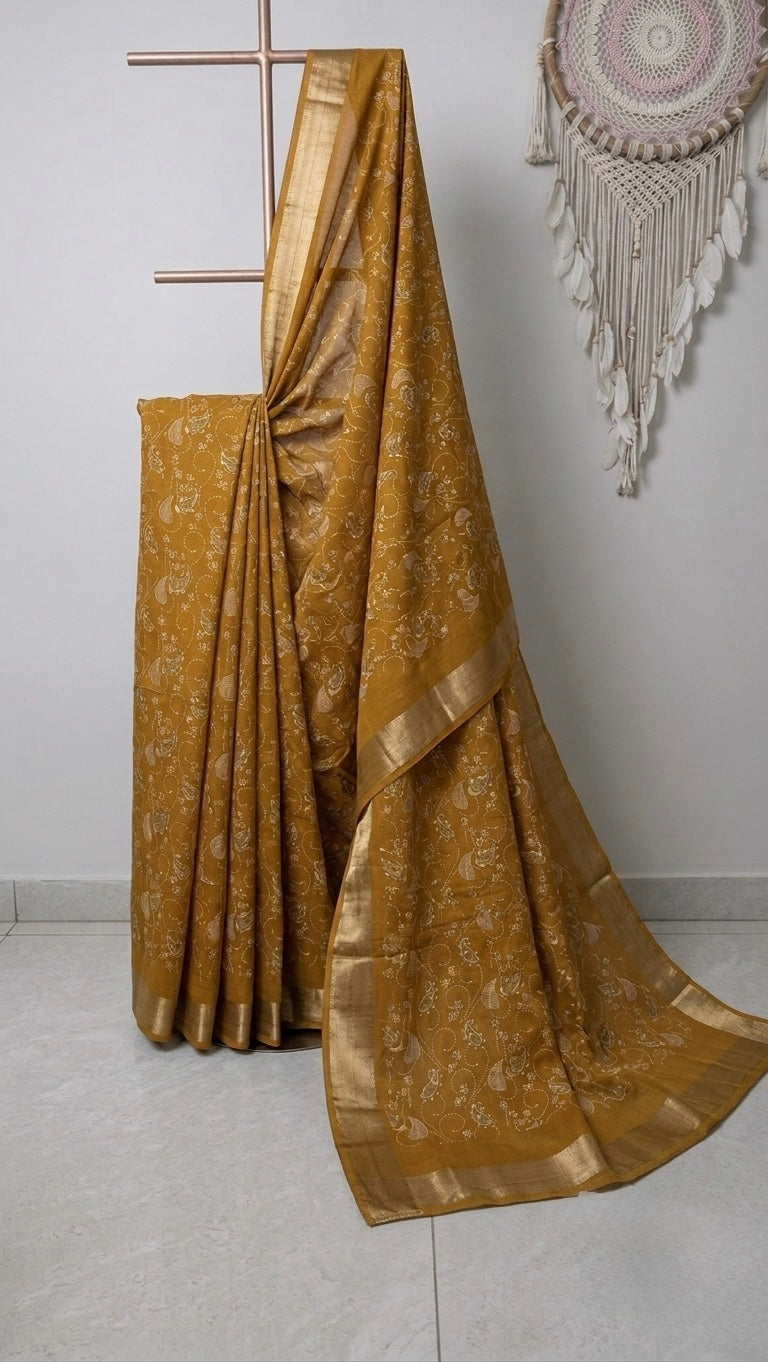 The Golden Ochre Drape: Textured Handloom Saree with Delicate Paisley Embroidery and Zari Border